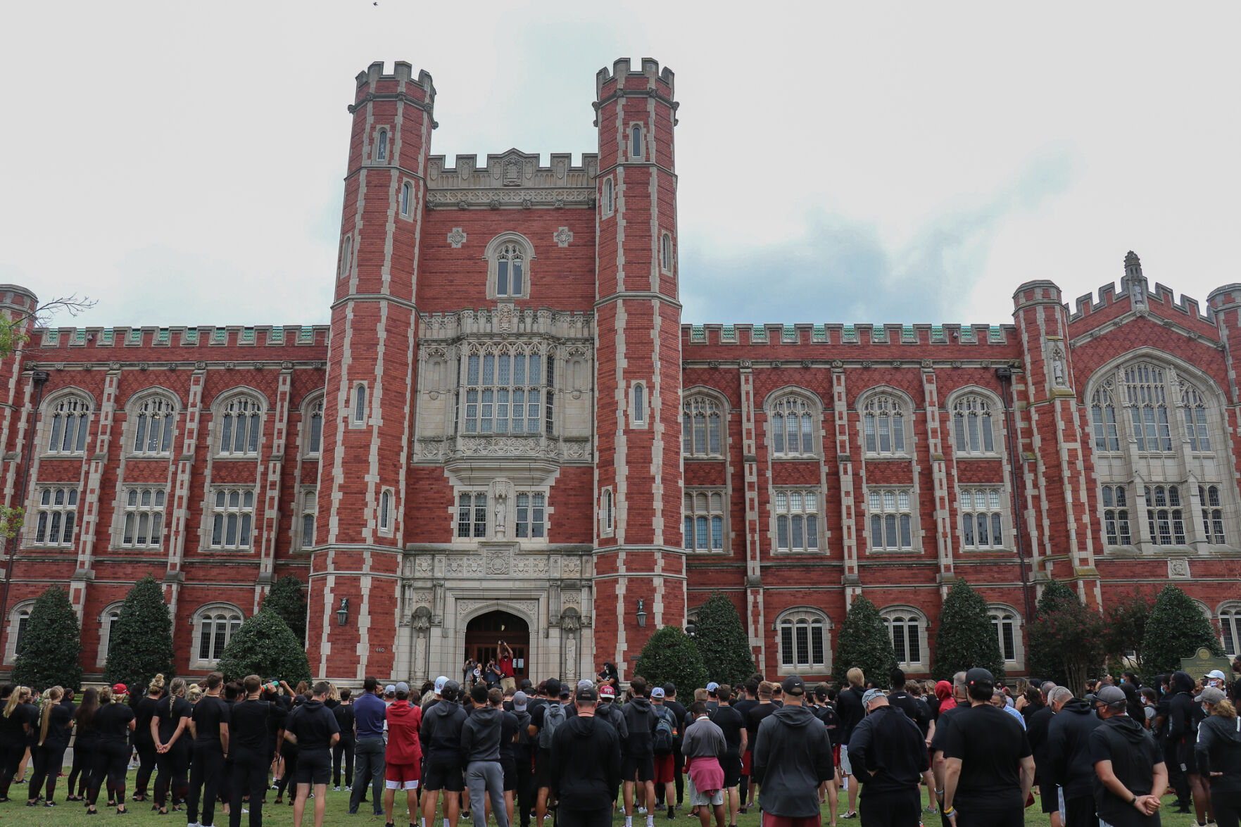 OU Athletes gather around library